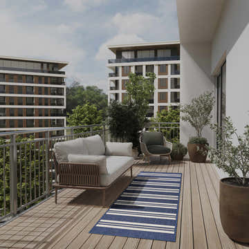 Balcony scene with a Nourison Horizon Navy Modern Area Rug, sofa, chair, and potted plants.