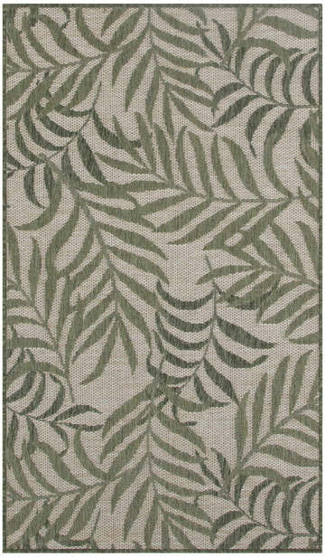 Close-up of Nourison Garden Oasis Ivory Green Tropical Area Rug with a woven texture and leafy chestnut pattern.
