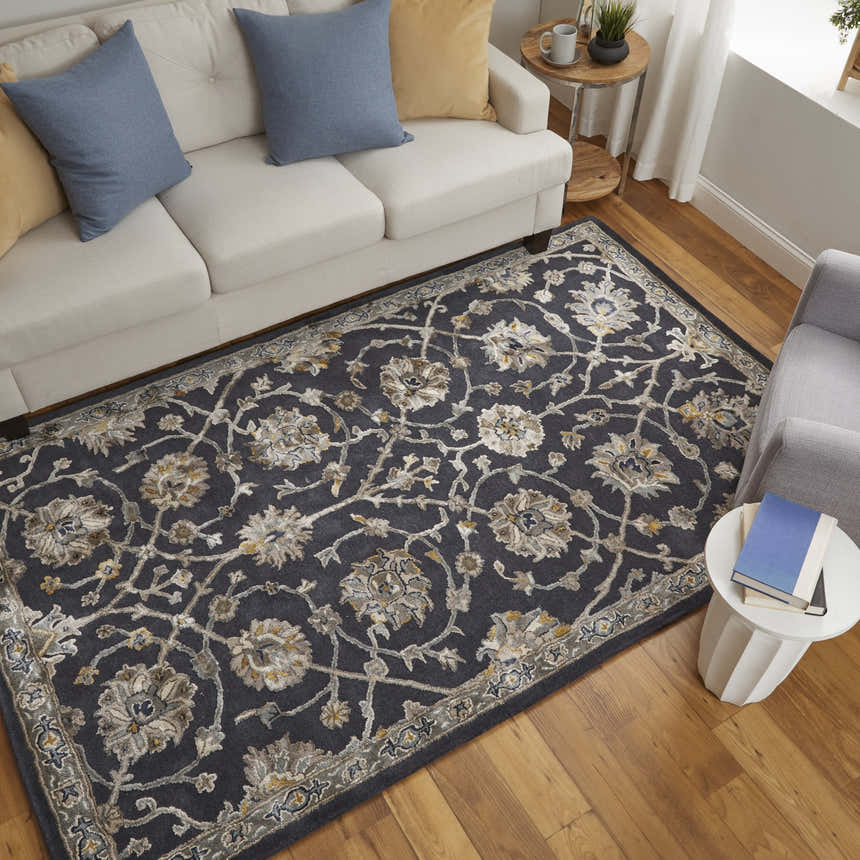 Living room scene with Feizy Prescott rug in blue, silver, and gray. Floral rug under sofa and chair on wood floor. Roomscene-Rectangle