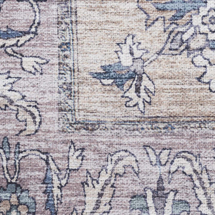 Close-up of the Nourison Grand s Blush Vintage Rug. Blush pink, beige, and blue floral pattern. Machine-made texture.
