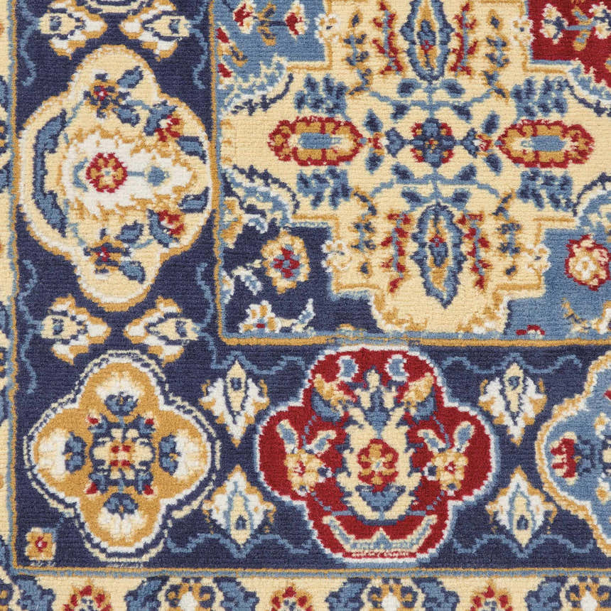 Close up of the Nourison Grafix Multicolor Bohemian Indoor Area Rug, showing a floral pattern in blue, red, and beige.