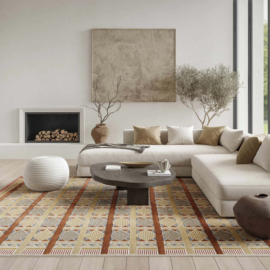 Modern living room with a neutral sectional sofa and Nourison Nordic Rust Multicolor area rug with a geometric pattern.