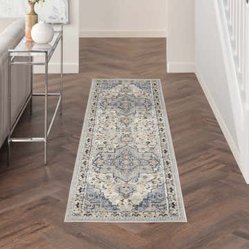 Hallway with Nourison Essentials Persian Blue Vintage Area Rug runner on hardwood floors.