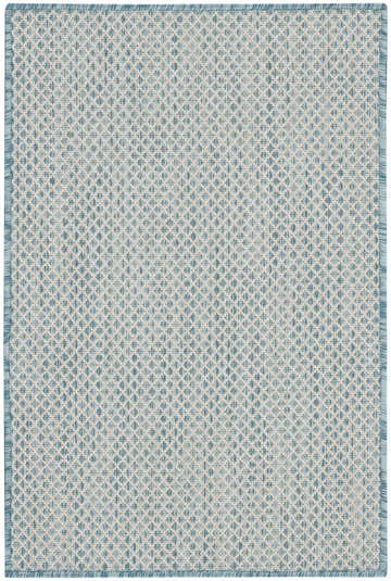 Close-up of Nourison Courtyard Ivory Aqua Modern Area Rug. Woven texture with a geometric diamond pattern in aqua and ivory.
