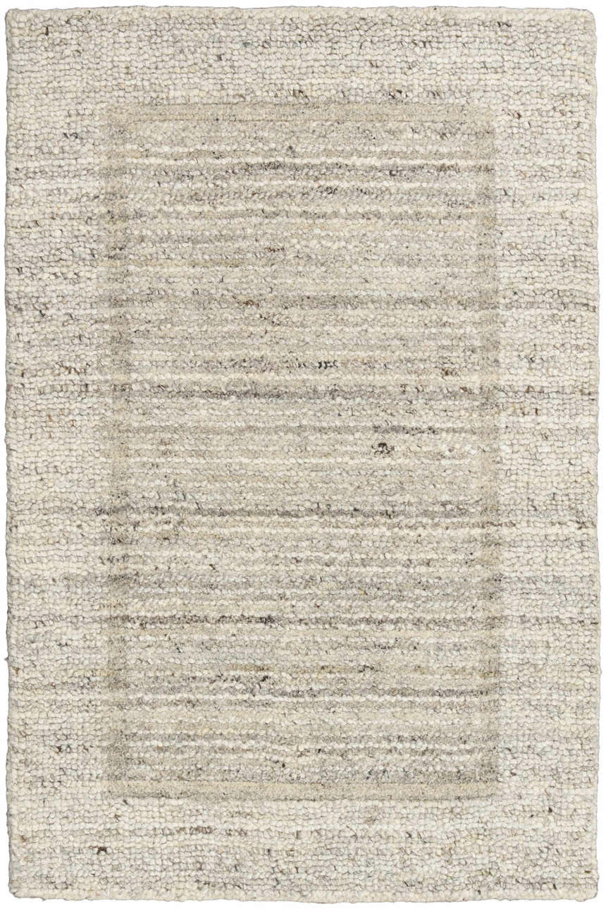 Close-up of the Calvin Klein CK082 Ridge rug. Farmhouse style with a textured, ivory and grey wool design.