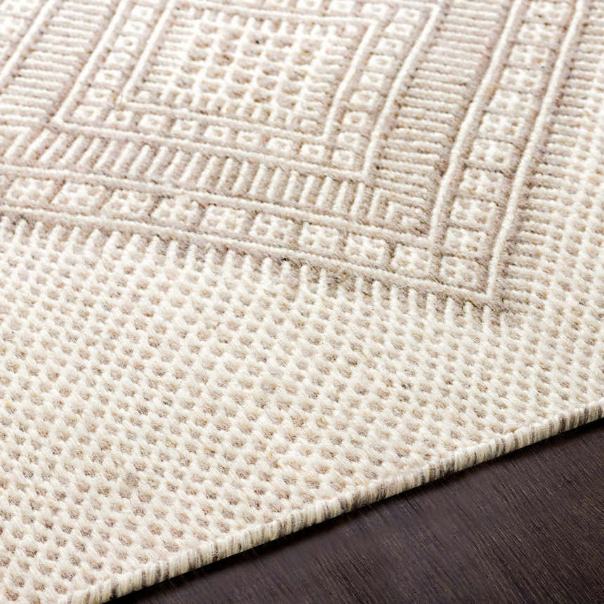 Close-up of the hand woven Aanislag Cream Wool Runner, showcasing its geometric pattern and textured wool construction. Texture