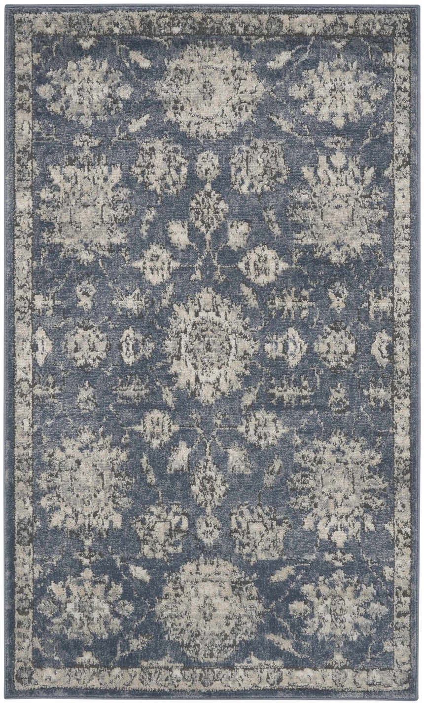 Close-up of the Nourison Quarry Blue Beige Vintage Area Rug, showcasing its floral pattern and distressed texture.