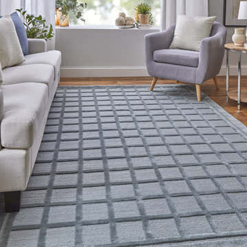 Living room with gray sofa, chair, and Feizy Channels Modern Geometric Gray/Blue Area Rug. Roomscene-Rectangle