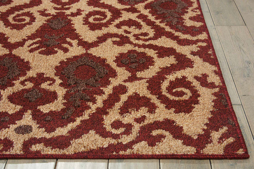 Close-up of Nourison Kindred Ivory/Red rug showing chestnut, ivory, and red floral pattern and texture.