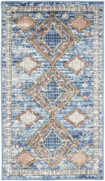 Close-up of Nourison Quarry Blue Vintage rug. Light blue with diamond pattern in rust and cream. Distressed look.