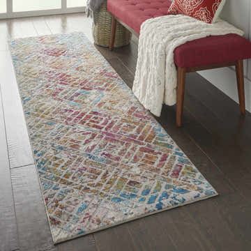 Entryway with Nourison Radiant Grey Multicolor runner rug, red bench, and dark wood floors.