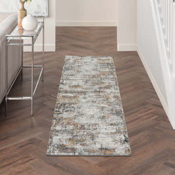 Hallway with Nourison Tangra Grey Multicolor rug, wood floors, console table, and neutral decor.