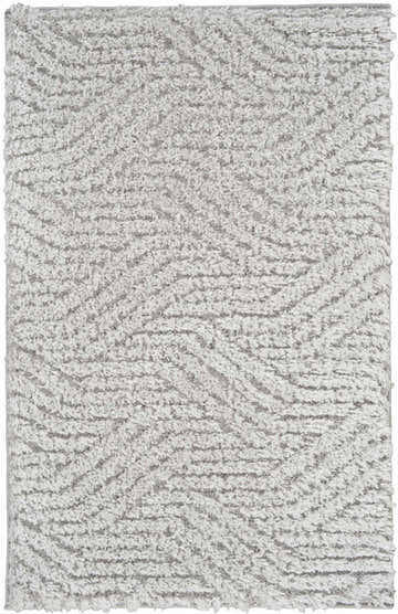 Close-up of a plush Calvin Klein Surfaces Silver Grey shag rug with a subtle wave pattern and soft texture.