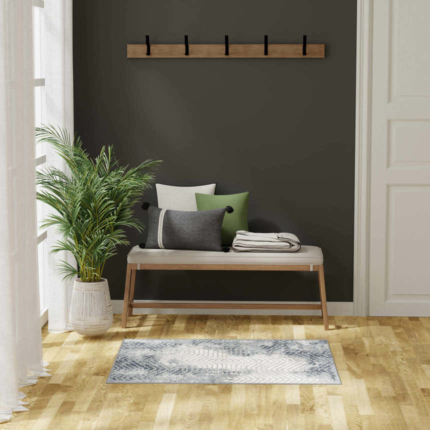 Entryway with a bench and the Nourison Dekor Grey Navy Modern Indoor Area Rug.