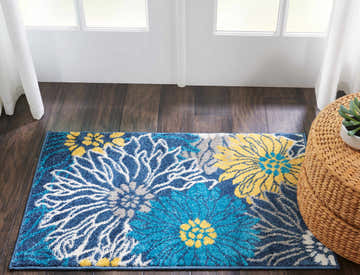 Entryway with Nourison Passion Blue rug featuring a floral design in light blue, yellow, and white.
