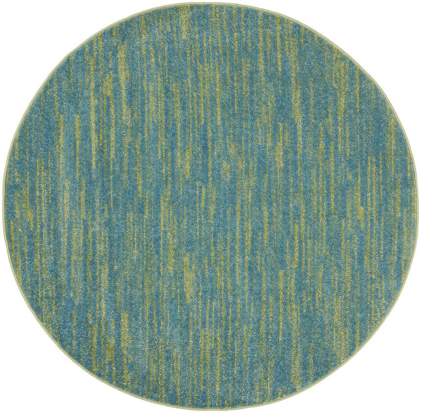 Close-up of a round Nourison Essentials Blue Green Outdoor Area Rug with a subtle vertical striped pattern.