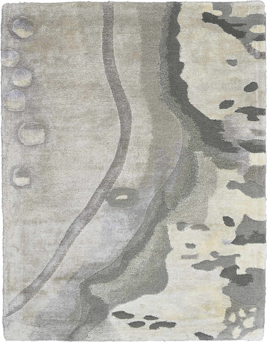 Close-up of the Nourison Prismatic Silver Cloud rug. Abstract design in shades of silver, gray, and cream. Soft, textured pile.