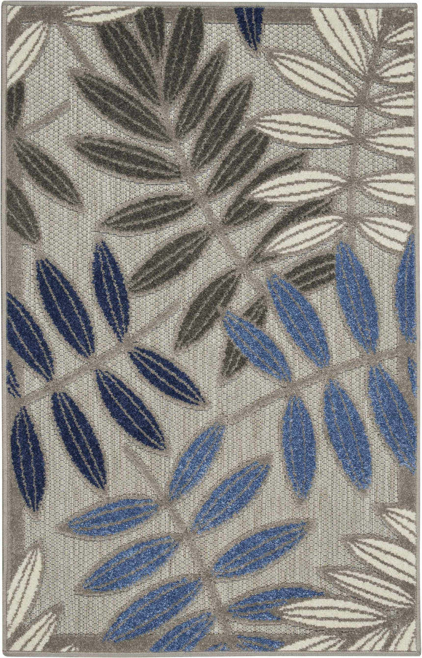 Close-up of the Nourison Aloha Grey Blue Tropical Area Rug featuring a leaf pattern in blue, gray, and white.