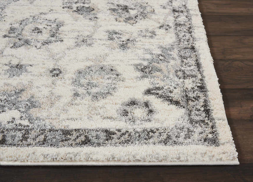 Close-up of the Nourison Fusion Cream Grey Vintage Area Rug showing the soft texture and vintage pattern.
