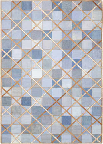Close-up of the Barclay Butera Cooper Denim Indoor Area Rug, featuring blue patchwork squares and a tan lattice design.