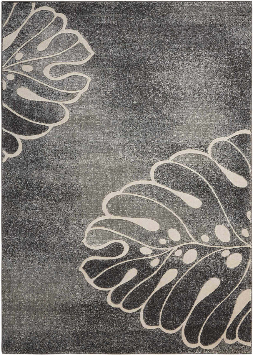 Close-up of Nourison Maxell Grey rug. Modern design with large, stylized leaf pattern in light gray on a textured gray background.