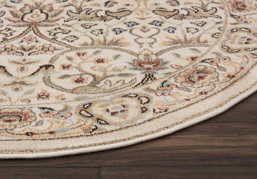 Close-up of the round Nourison Walden Ivory rug. Features chestnut, tan, and blue floral and paisley design on an ivory background.
