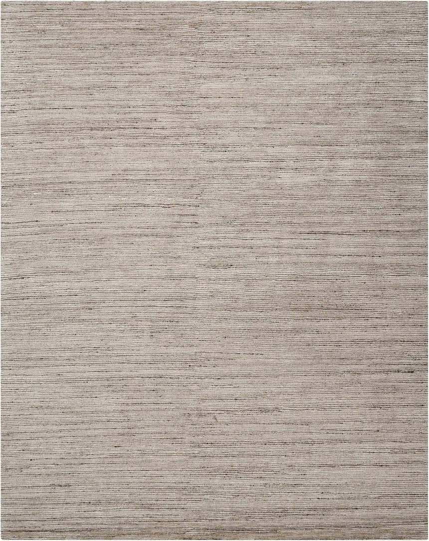 Close-up of the Nourison OCEAN Sand area rug. Sandstone color with a subtle, linear texture. Handmade rug.