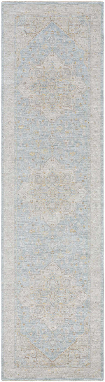 Close-up of the Arjun Thick Luxe Area Rug. Traditional rug design in light blue, beige, and gold tones. Design-Runner-2710