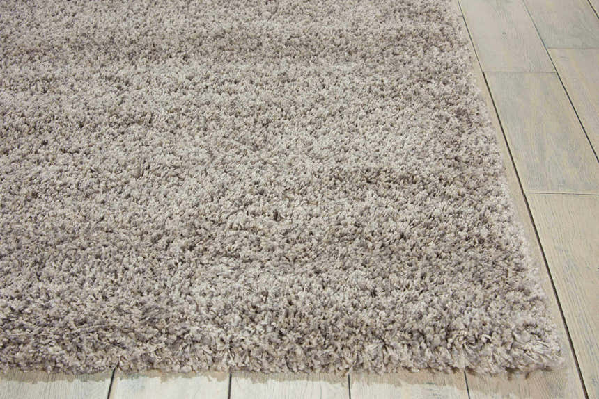 Close-up of the plush texture and light gray color of the Nourison Amore Shag Area Rug.