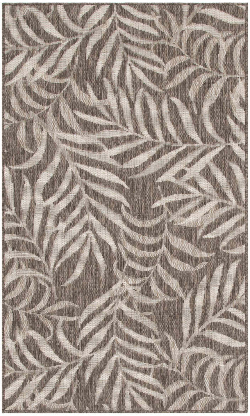 Close-up of Nourison Garden Oasis Mocha Tropical Area Rug featuring a light brown leaf pattern.