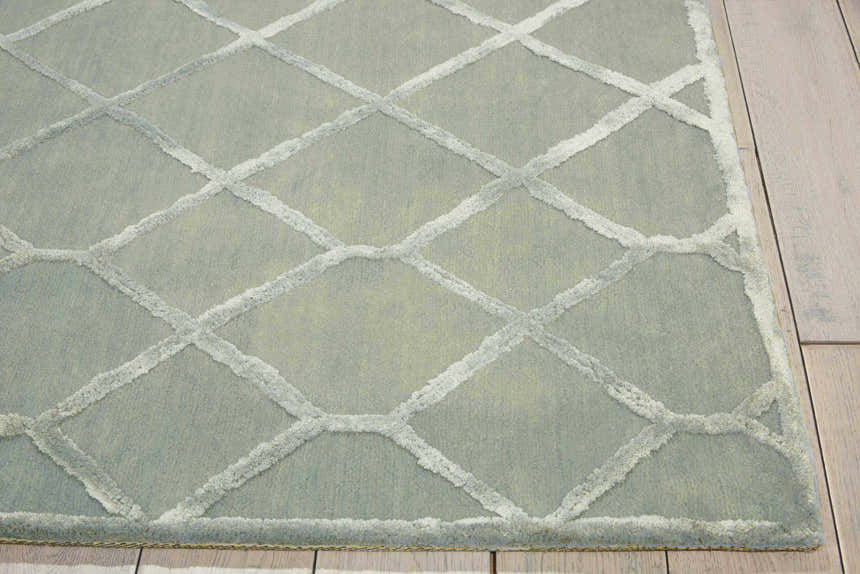 Close up of Nourison Vita Sage rug showing diamond trellis pattern and soft, muted sage color.