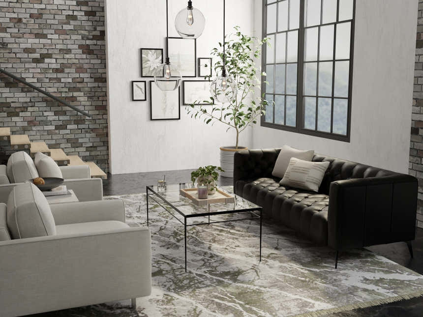 Modern living room with black sofa and Feizy Cadiz Gray/Green/Taupe area rug, creating a contemporary, stylish space. Roomscene-Rectangle