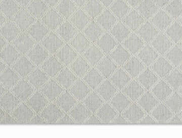 Close-up of the Calvin Klein Tallahassee Silver rug showing its diamond pattern and wool texture.