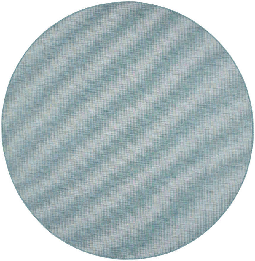 Close-up of a round Nourison Positano Aqua rug. The rug has a subtle woven texture in light blue tones.