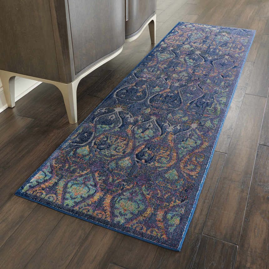 Hallway scene with Nourison Ankara Global Navy Multicolor rug runner on dark wood floors.