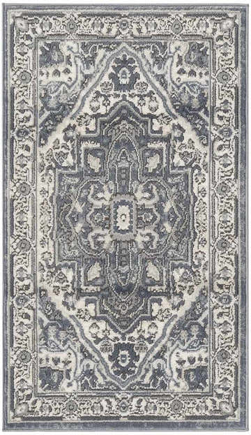 Close-up of the Nourison Quarry Navy Ivory Vintage Indoor Area Rug with a detailed floral and geometric pattern.