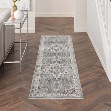 Hallway scene with a Nourison Quarry Grey Ivory Vintage Indoor Area Rug runner on herringbone wood floors.