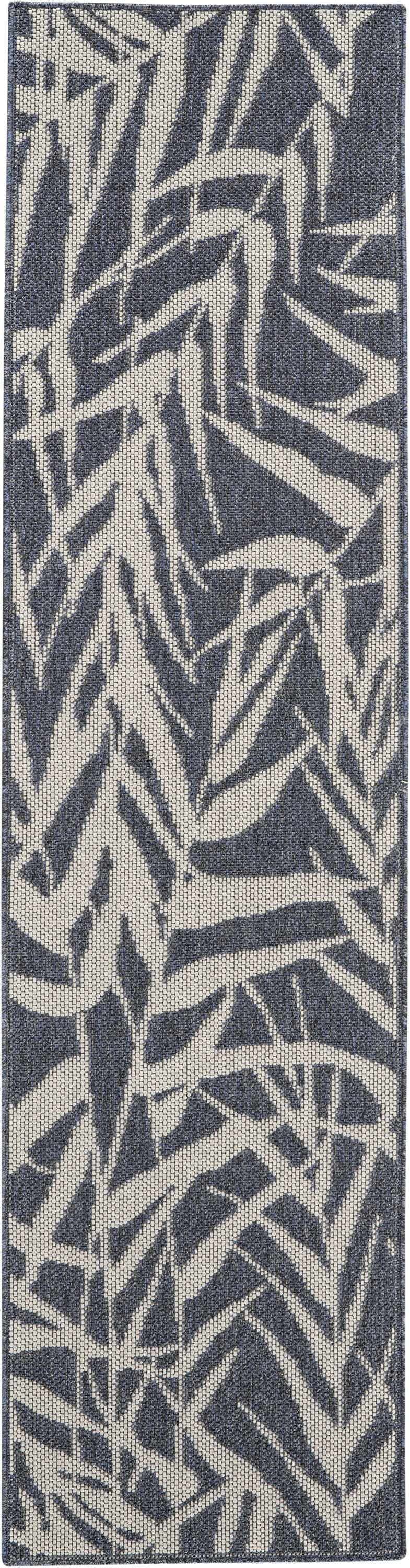 Close-up of the Nourison Aruba Slate/Cream Beach Area Rug showing its leaf pattern and textured weave.
