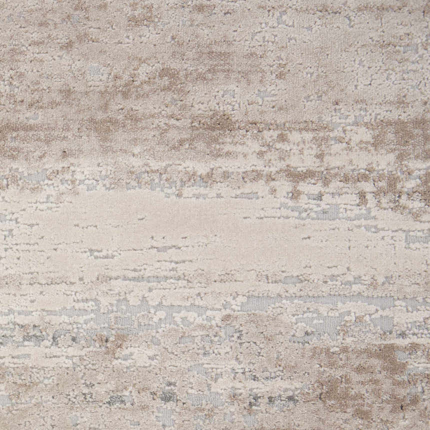 Close-up of the Nourison Rustic Textures Beige area rug, showing its textured, abstract pattern and neutral color palette.