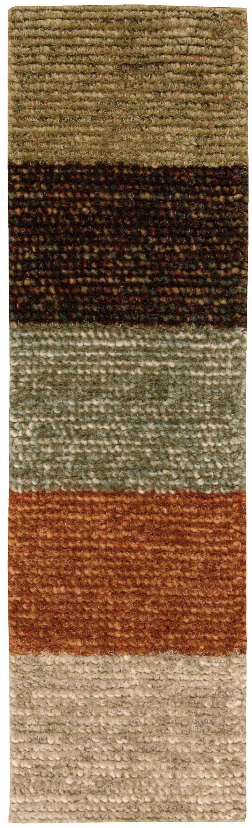 Close-up of the handmade Nourison Fantasia Blanket Shag rug. Features stripes of brown, green, copper, and beige wool.