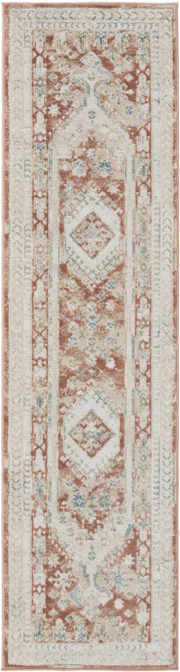 Close-up of Nourison Thalia Rust Multicolor rug. Vintage style, long pile, with rust, beige, and blue diamond pattern.