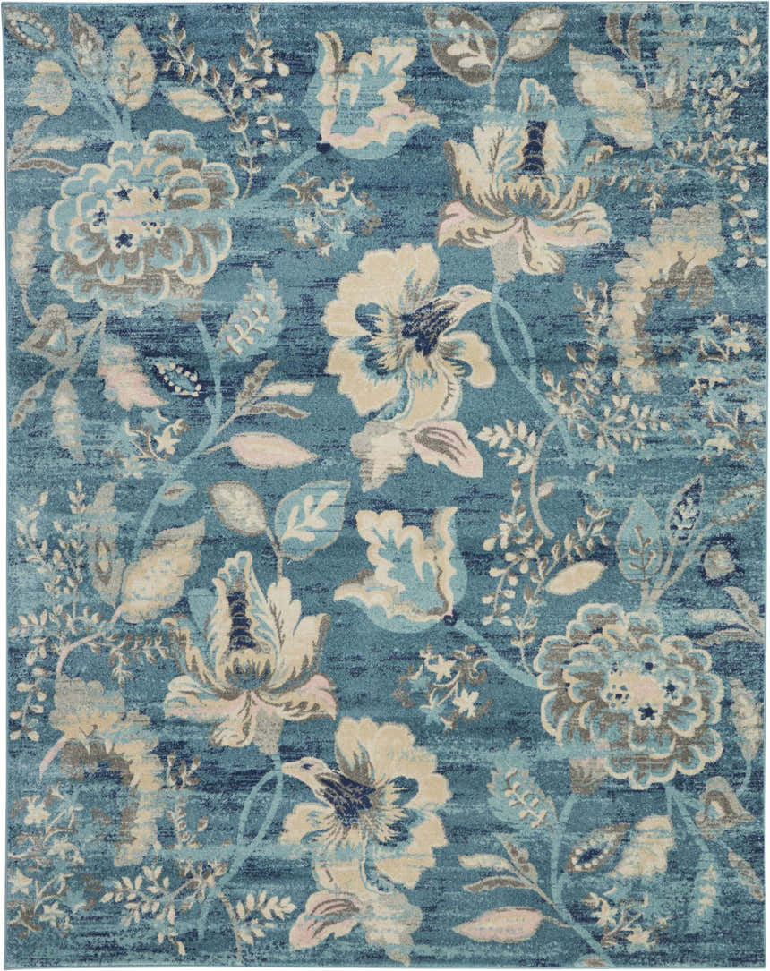 Close-up of the Nourison Tranquil Turquoise Vintage Indoor Area Rug, featuring a floral pattern in aqua, beige, and gray tones.