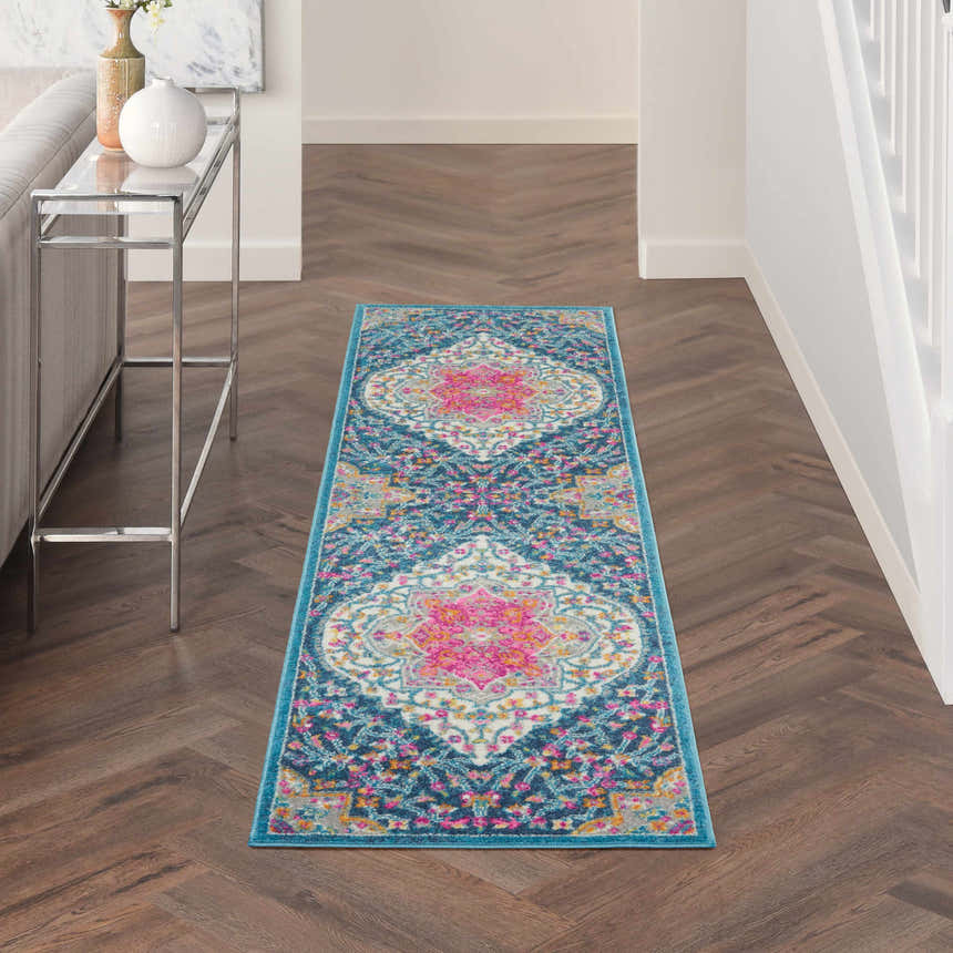 Hallway with Nourison Passion Multicolor runner rug, wood floors, console table, and bright, airy feel.