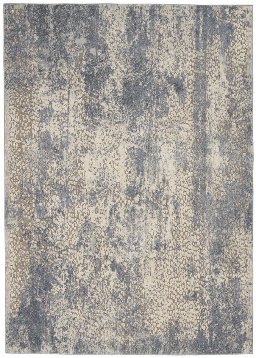 Close-up of Nourison Sahara Ivory/Slate rug. Artistic design in ivory, slate blue, and chestnut colors. Abstract pattern.