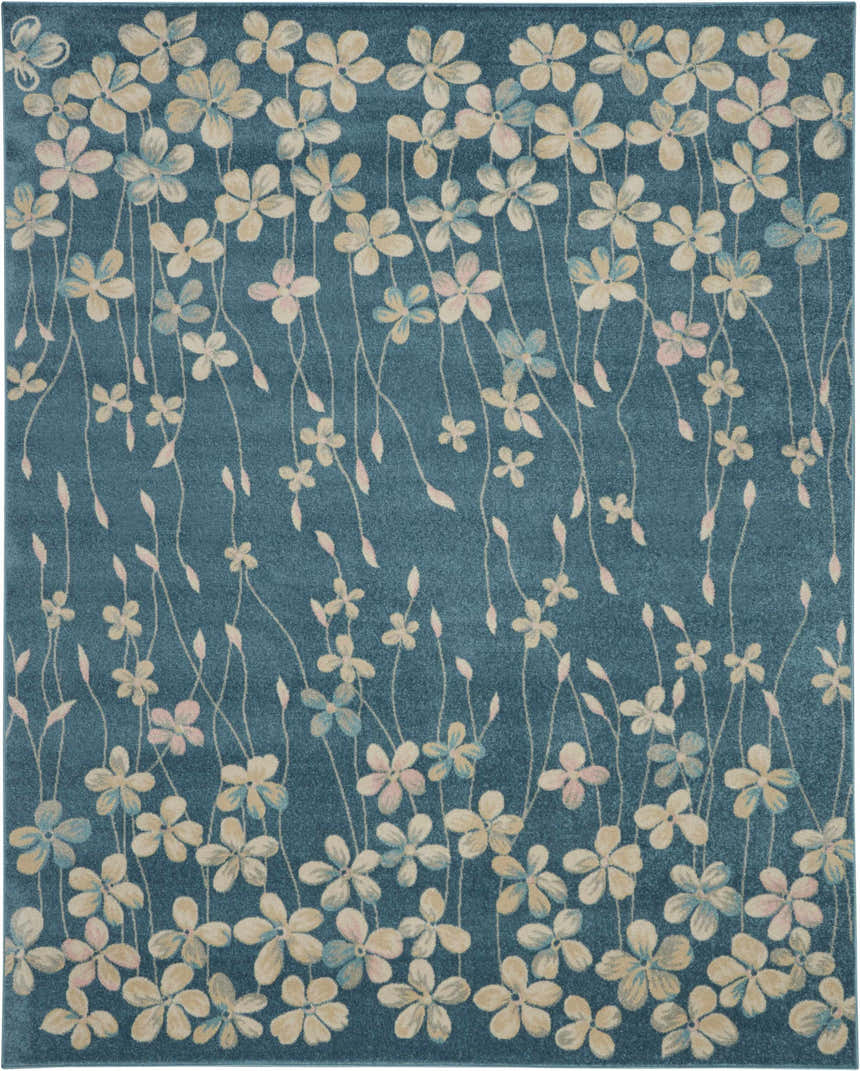 Close-up of the Nourison Tranquil Turquoise rug featuring a floral pattern with aqua, pink, and beige flowers.