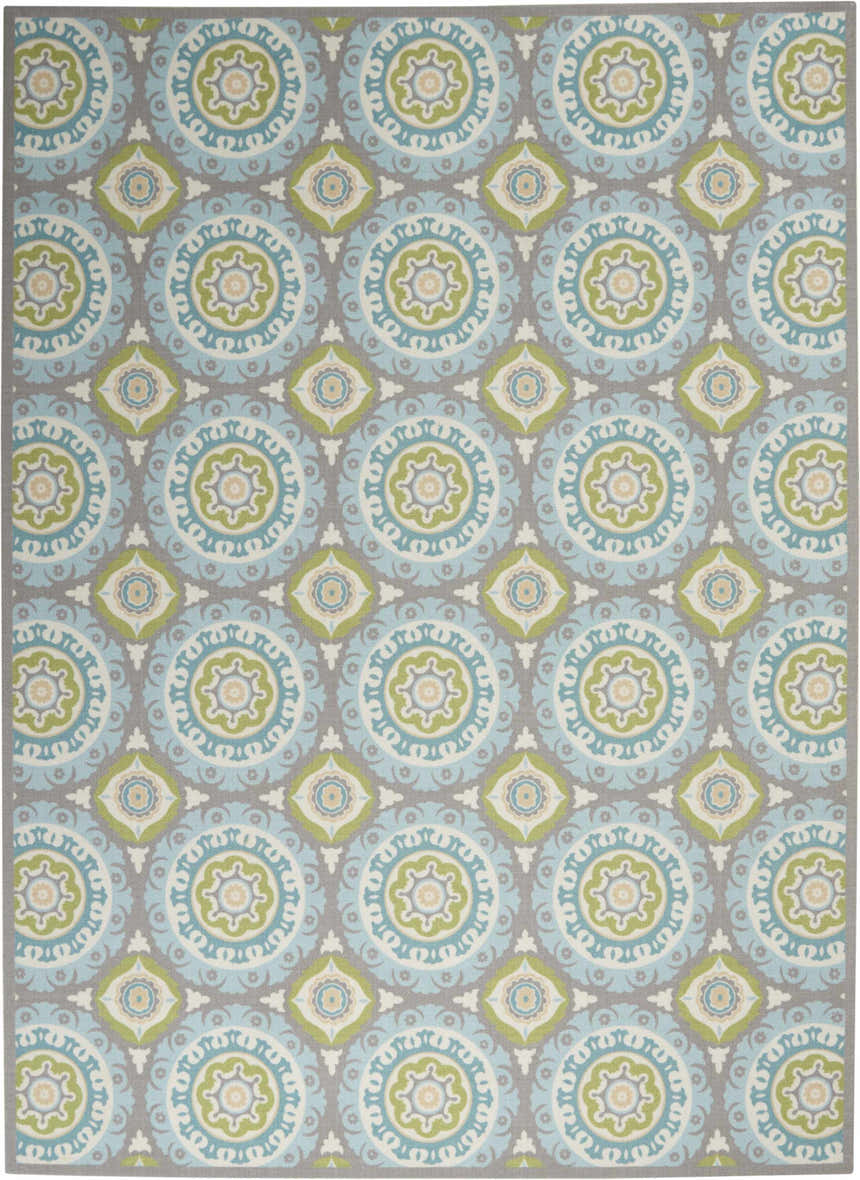 Waverly Sun N' Shade Jade rug: A close-up shows a coastal-style rug with a geometric medallion pattern in jade, blue, and gray.
