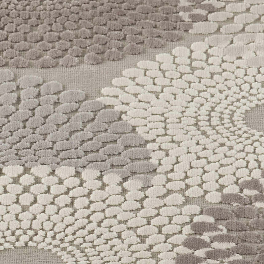 Close-up of the textured Nourison Graphic Illusions Grey Mid-Century Modern rug, showing gray and ivory geometric design.