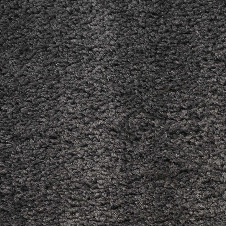 Close-up of the plush texture of the Nourison Dreamy Shag Grey Shag Indoor Area Rug.
