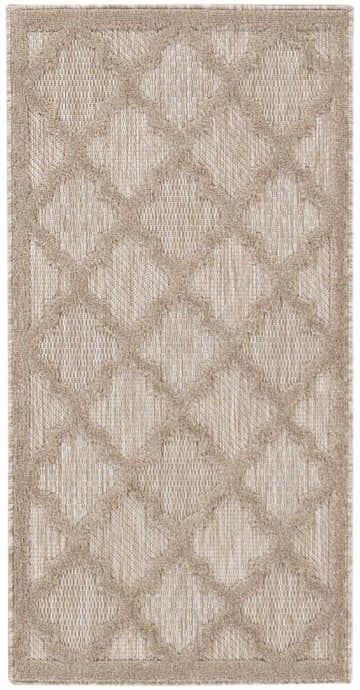 Close-up of Nourison Easy Care Natural Beige Area Rug; beige quatrefoil pattern on a textured, neutral background.