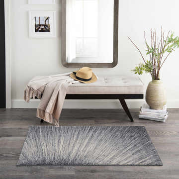 Entryway with bench, mirror, and Nourison Moroccan Celebration Blue Grey rug. Modern style.